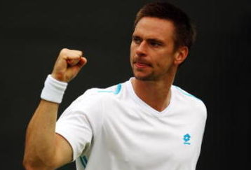 WIMBLEDON, ENGLAND - JUNE 22:  Robin Soderling of Sweden clenches his fist during the men's singles first round match against Gilles Muller of Luxembourg on Day One of the Wimbledon Lawn Tennis Championships at the All England Lawn Tennis and Croquet Club on June 22, 2009 in London, England.  (Photo by Julian Finney/Getty Images)