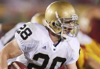 LOS ANGELES - NOVEMBER 29:  Kyle McCarthy #28 of the Notre Dame Fighting Irish returns an interception eight yards out of the endzone against the USC Trojans in the third quarter on November 29, 2008 at the Los Angeles Memorial Coliseum in Los Angeles, California.  USC won 38-3.  (Photo by Jeff Golden/Getty Images) 