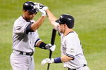 BALTIMORE - MAY 09:  Mark Teixeria #25 of the New York Yankees is congratulated by Alex Rodriguez #13 after hitting a home run in the fifth inning against the Baltimore Orioles at Oriole Park at Camden Yards on May 9, 2009 in Baltimore, Maryland.  (Photo by Greg Fiume/Getty Images)