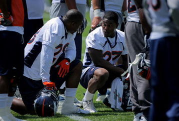 ENGLEWOOD, CO - JUNE 12:  Free agent running back Correll Buckhalter #28 chats with first round draft pick running back Knowshon Moreno #27 of the Denver Broncos during minicamp practice at the Broncos Dove Valley training facility on June 12, 2009 in Englewood, Colorado.  (Photo by Doug Pensinger/Getty Images)