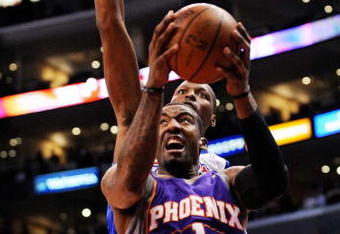 LOS ANGELES, CA - FEBRUARY 18:  Amar'e Stoudamire #1 of the Phoenix Suns scores a basket against Al Thornton #12 of the Los Angeles Clippers during the first quarter at the Staples Center February 18, 2009, in Los Angeles, California. NOTE TO USER: User expressly acknowledges and agrees that, by downloading and or using this photograph, User is consenting to the terms and conditions of the Getty Images License Agreement.  (Photo by Kevork Djansezian/Getty Images)