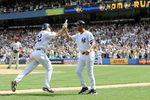NEW YORK - AUGUST 03:  Xavier Nady #22 (L) and third base coach Bobby Meacham #50 of the New York Yankees celebrate Nady's three-run home run against the Los Angeles Angels of Anaheim on August 3, 2008 at Yankee Stadium in the Bronx borough of New York City. (Photo by Jeff Zelevansky/Getty Images)