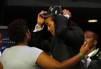 NEW YORK - JUNE 25:  Eighth overall draft pick by the New York Knicks,  Jordan Hill is congratulated by members of his entourage during the 2009 NBA Draft at the Wamu Theatre at Madison Square Garden June 25, 2009 in New York City. NOTE TO USER: User expressly acknowledges and agrees that, by downloading and/or using this Photograph, User is consenting to the terms and conditions of the Getty Images License Agreement.  (Photo by Jim McIsaac/Getty Images)
