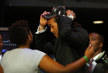 NEW YORK - JUNE 25:  Eighth overall draft pick by the New York Knicks,  Jordan Hill is congratulated by members of his entourage during the 2009 NBA Draft at the Wamu Theatre at Madison Square Garden June 25, 2009 in New York City. NOTE TO USER: User expressly acknowledges and agrees that, by downloading and/or using this Photograph, User is consenting to the terms and conditions of the Getty Images License Agreement.  (Photo by Jim McIsaac/Getty Images)