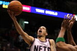 EAST RUTHERFORD, NJ - MARCH 04:  Devin Harris #34 of the New Jersey Nets shoots the ball against Stephon Marbury #8 of the Boston Celtics during their game on March 4, 2009 at The Izod Center in East Rutherford, New Jersey.  NOTE TO USER: User expressly acknowledges and agrees that, by downloading and/or using this Photograph, user is consenting to the terms and conditions of the Getty Images License Agreement. (Photo by Al Bello/Getty Images)