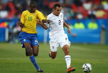 PRETORIA, SOUTH AFRICA - JUNE 18:  Jonathan Bornstein of USA battles with Ramires of Brazil during the FIFA Confederations Cup match between USA and Brasil at Loftus Versfeld Stadium on June 18, 2009 in Pretoria, South Africa.  (Photo by Jamie McDonald/Getty Images)