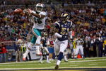 ST. LOUIS, MO. - NOVEMBER 30:  Davone Bess #15 of the Miami Dolphins attempts to make a touchdown catch against Will Witherspoon #51 of the St. Louis Rams at the Edward Jones Dome on November 30, 2008 in St. Louis, Missouri.  (Photo by Dilip Vishwanat/Getty Images)