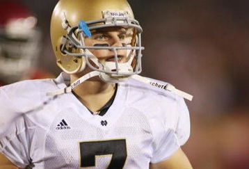 LOS ANGELES - NOVEMBER 29:  Jimmy Clausen #7 of the Notre Dame Fighting Irish walks on the field against the USC Trojans on November 29, 2008 at the Los Angeles Memorial Coliseum in Los Angeles, California.  USC won 38-3.  (Photo by Jeff Golden/Getty Images)
