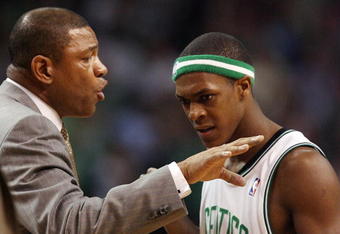BOSTON - APRIL 28:  Head coach Doc Rivers talks with Rajon Rondo #9 of the Boston Celtics during a time out against the Chicago Bulls in Game Five of the Eastern Conference Quarterfinals during the 2009 NBA Playoffs at TD Banknorth Garden on April 28, 2009 in Boston, Massachusetts. The Celtics defeated the Bulls 106-104 in overtime. NOTE TO USER: User expressly acknowledges and agrees that, by downloading and or using this photograph, User is consenting to the terms and conditions of the Getty Images License Agreement.  (Photo by Elsa/Getty Images)