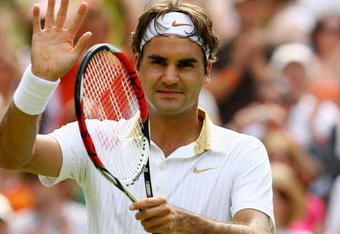 WIMBLEDON, ENGLAND - JUNE 26:  Roger Federer of Switzerland salutes the crowd after victory during the men's singles third round match against Philipp Kohlschreiber of Germany on Day Five of the Wimbledon Lawn Tennis Championships at the All England Lawn Tennis and Croquet Club on June 26, 2009 in London, England.  (Photo by Paul Gilham/Getty Images)