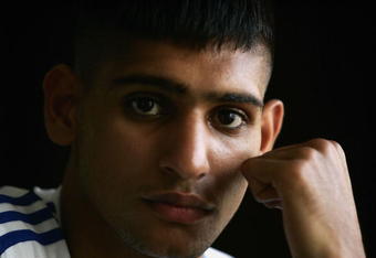 CORAL BAY, CYPRUS - AUGUST 8:  Boxer Amir Kahn of Great Britain poses inside the team hotel at the Team GB Holding Camp, on August 8, 2004 in Coral Bay, Cyprus. Amir Kahn is the only British Boxer competing at the 2004 Olympic Games starting on August 13 in Athens, Greece.  (Photo by Paul Gilham/Getty Images)