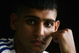 CORAL BAY, CYPRUS - AUGUST 8: Boxer Amir Kahn of Great Britain poses inside the team hotel at the Team GB Holding Camp, on August 8, 2004 in Coral Bay, Cyprus. Amir Kahn is the only British Boxer competing at the 2004 Olympic Games starting on August 13 in Athens, Greece. (Photo by Paul Gilham/Getty Images)