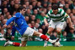 GLASGOW, UNITED KINGDOM - FEBRUARY 15: Scott McDonald of Celtic tackles Pedro Mendes of Rangers during the Scottish Premier League match between Celtic and Rangers at Celtic Park on February 15, 2009 in Glasgow, Scotland.  (Photo by Jeff J Mitchell/Getty Images)