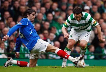 GLASGOW, UNITED KINGDOM - FEBRUARY 15: Scott McDonald of Celtic tackles Pedro Mendes of Rangers during the Scottish Premier League match between Celtic and Rangers at Celtic Park on February 15, 2009 in Glasgow, Scotland.  (Photo by Jeff J Mitchell/Getty Images)