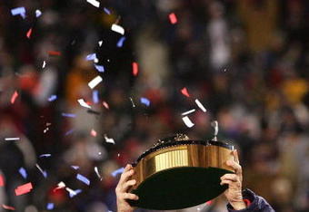FOXBORO, MA - JANUARY 20:  Head coach Bill Belichick of the New England Patriots celebrates with the Lamar Hunt Trophy after the Patriots 21-12 win against the San Diego Chargers during the AFC Championship Game on January 20, 2008 at Gillette Stadium in Foxboro, Massachusetts.  (Photo by Chris McGrath/Getty Images)