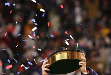 FOXBORO, MA - JANUARY 20:  Head coach Bill Belichick of the New England Patriots celebrates with the Lamar Hunt Trophy after the Patriots 21-12 win against the San Diego Chargers during the AFC Championship Game on January 20, 2008 at Gillette Stadium in Foxboro, Massachusetts.  (Photo by Chris McGrath/Getty Images)
