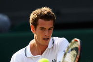WIMBLEDON, ENGLAND - JUNE 25:  Andy Murray of Great Britain plays a backhand during the men's singles second round match against Ernests Gulbis of Latvia on Day Four of the Wimbledon Lawn Tennis Championships at the All England Lawn Tennis and Croquet Club on June 25, 2009 in London, England.  (Photo by Clive Brunskill/Getty Images)