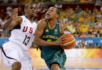 BEIJING - AUGUST 20:  Patrick Mills #5 of Australia drives to the basket over Chris Paul #13 of the United States during the men's basketball quarterfinal game at the Olympic Basketball Gymnasium during Day 12 of the Beijing 2008 Olympic Games on August 20, 2008 in Beijing, China.  (Photo by Streeter Lecka/Getty Images)