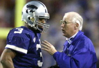 TEMPE, AZ - JANUARY 2:  Head coach Bill Snyder of the Kansas State Wildcats gives directions to quarterback Ell Roberson #3 during the second half of the Fiesta Bowl against the Ohio State Buckeyes on January 2, 2004 at the Sun Devil Stadium in Tempe, Arizona.  (Photo by Elsa /Getty Images)  