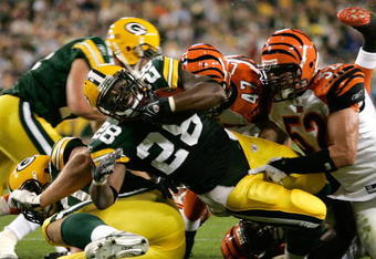 GREEN BAY, WI - AUGUST 11: Running back Kregg Lumpkin #28 of the Green Bay Packers dives in the end zone for a touchdown against the Cincinnati Bengals at the Lambeau Field on August 11, 2008 in Green Bay, Wisconsin. The Bengals defeated the Packers 20-17. (Photo by Scott Boehm/Getty Images)