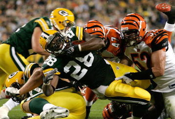 GREEN BAY, WI - AUGUST 11: Running back Kregg Lumpkin #28 of the Green Bay Packers dives in the end zone for a touchdown against the Cincinnati Bengals at the Lambeau Field on August 11, 2008 in Green Bay, Wisconsin. The Bengals defeated the Packers 20-17. (Photo by Scott Boehm/Getty Images)