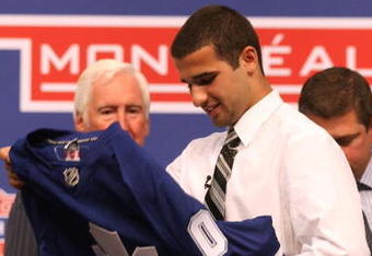 MONTREAL, QC - JUNE 26:  Nazem Kadri puts on his new Toronto Maple Leafs sweater after he was selected #7 overall by the Leafs during the first round of the 2009 NHL Entry Draft at the Bell Centre on June 26, 2009 in Montreal, Quebec, Canada.  (Photo by Bruce Bennett/Getty Images)