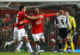 MANCHESTER, UNITED KINGDOM - JANUARY 20:  Nani of Manchester United celebrates scoring the opening goal with team mate Darron Gibson (L) during the Carling Cup Semi Final 2nd Leg match between Manchester United and Derby County at Old Trafford on January 20, 2009 in Manchester, England.  (Photo by Alex Livesey/Getty Images)