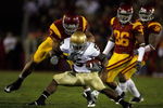LOS ANGELES, CA - NOVEMBER 29:  Armando Allen #5 of the Nortre Dame Fighting Irsh is stopped by Taylor Mays #2, Josh Pinkard #36 and Rey Maualuga #58 of the USC Trojans during the second quarter at the Coliseum on November 29, 2008 in Los Angeles, California.  (Photo by Harry How/Getty Images)