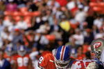SAN FRANCISCO - AUGUST 3:  Safeties Dennis Smith #49 and Steve Atwater #27 of the Denver Broncos team up for a tackle during pre season game against the San Francisco 49ers at Candlestick Park on August 3, 1992 in San Francisco, California.  The 49ers won 13-7.  (Photo by George Rose/Getty Images)