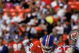 SAN FRANCISCO - AUGUST 3:  Safeties Dennis Smith #49 and Steve Atwater #27 of the Denver Broncos team up for a tackle during pre season game against the San Francisco 49ers at Candlestick Park on August 3, 1992 in San Francisco, California.  The 49ers won 13-7.  (Photo by George Rose/Getty Images)
