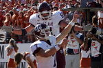 AUSTIN, TX - NOVEMBER 24:  Quarterback Stephen McGee #7 of the Texas A&M Aggies celebrates his touchdown with Joey Thomas #81 during a game against the Texas Longhorns at Darrell K Royal-Texas Memorial Stadium November 24, 2006 in Austin, Texas. The Aggies defeated the Longhorns 12-7.  (Photo by Ronald Martinez/Getty Images)