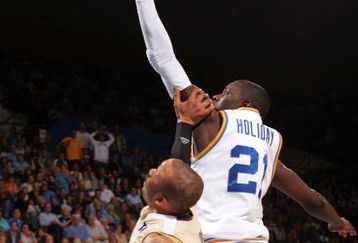 WESTWOOD, CA - FEBRUARY 19:  Jrue Holiday #21 of the UCLA Bruins lays up a shot in the second half against the Washington Huskies during their NCAA basketball game at Pauley Pavilion on February 19, 2009 in Westwood, California. The Bruins defeated the Huskies 85-76.  (Photo by Victor Decolongon/Getty Images)
