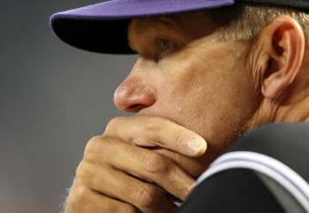 PHOENIX - APRIL 08:  Coach Jim Tracy of the Colorado Rockies looks on during the game against the Arizona Diamondbacks at Chase Field on April 8, 2009 in Phoenix, Arizona. The Rockies defeated the Diamondbacks 9-2.  (Photo by Christian Petersen/Getty Images)