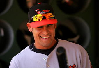 OAKLAND, CA - JUNE 07:  Oscar Salazar #26 of the Baltimore Orioles stands in the dugout before their game against the Oakland Athletics at the Oakland Coliseum on June 7, 2009 in Oakland, California.  (Photo by Ezra Shaw/Getty Images)