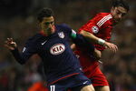 LIVERPOOL, UNITED KINGDOM - NOVEMBER 04:  Maxi Rodriguez of Atletico Madrid is pressurised by Albert Riera of Liverpool during the UEFA Champions League Group D match between Liverpool and Atletico Madrid at Anfield on November 4, 2008 in Liverpool, England.  (Photo by Laurence Griffiths/Getty Images)