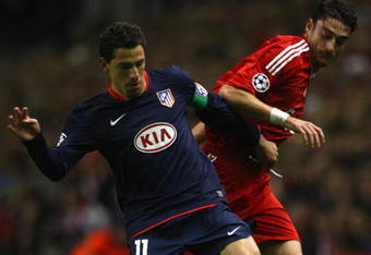 LIVERPOOL, UNITED KINGDOM - NOVEMBER 04:  Maxi Rodriguez of Atletico Madrid is pressurised by Albert Riera of Liverpool during the UEFA Champions League Group D match between Liverpool and Atletico Madrid at Anfield on November 4, 2008 in Liverpool, England.  (Photo by Laurence Griffiths/Getty Images)