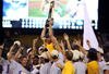 OMAHA, NE - JUNE 24:  Head coach Paul Mainieri of the Louisiana State University Tigers is held up by his team after defeating the Texas Longhorns during Game 3 of the 2009 NCAA College World Series at Rosenblatt Stadium on June 24, 2009 in Omaha, Nebraska. The Tigers defeated the Longhorns 11-4 to win the national title.  (Photo by Elsa/Getty Images)