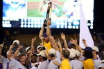 OMAHA, NE - JUNE 24:  Head coach Paul Mainieri of the Louisiana State University Tigers is held up by his team after defeating the Texas Longhorns during Game 3 of the 2009 NCAA College World Series at Rosenblatt Stadium on June 24, 2009 in Omaha, Nebraska. The Tigers defeated the Longhorns 11-4 to win the national title.  (Photo by Elsa/Getty Images)