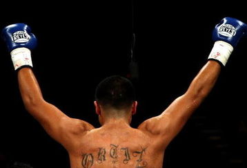 LAS VEGAS - DECEMBER 06:  Victor Ortiz reacts after defeating Jeffrey Resto by a second round TKO during their NABO junior welterweight title fight at the MGM Grand Garden Arena December 6, 2008 in Las Vegas, Nevada.  (Photo by Jed Jacobsohn/Getty Images)
