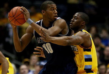MILWAUKEE - JANUARY 31: Greg Monroe #10 of the Georgetown Hoyas looks to pass as Dwight Burke #12 of the Marquette Golden Eagles defends on January 31, 2009 at the Bradley Center in Milwaukee, Wisconsin. Marquette defeated Georgetown 94-82.  (Photo by Jonathan Daniel/Getty Images)