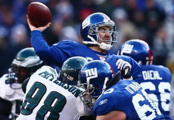 EAST RUTHERFORD, NJ -  JANUARY 11:  Eli Manning #10 of the New York Giants throws a pass against the Philadelphia Eagles during the NFC Divisional Playoff Game on January 11, 2009 at Giants Stadium in East Rutherford, New Jersey.  The Eagles defeated the Giants 23 -11. (Photo by Chris McGrath/Getty Images)
