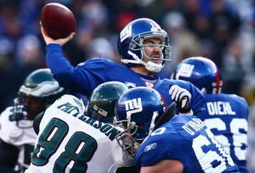 EAST RUTHERFORD, NJ -  JANUARY 11:  Eli Manning #10 of the New York Giants throws a pass against the Philadelphia Eagles during the NFC Divisional Playoff Game on January 11, 2009 at Giants Stadium in East Rutherford, New Jersey.  The Eagles defeated the Giants 23 -11. (Photo by Chris McGrath/Getty Images)