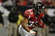 ATLANTA - DECEMBER 28:  Running back Michael Turner #33 of the Atlanta Falcons looks for room to run while taking on the St. Louis Rams at Georgia Dome on December 28, 2008 in Atlanta, Georgia. The Falcons defeated the Rams 31-27.  (Photo by Doug Benc/Getty Images)
