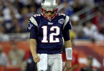 GLENDALE, AZ - FEBRUARY 03:  Quarterback Tom Brady #12 of the New England Patriots walks off the field in the second half of Super Bowl XLII against the New York Giants on February 3, 2008 at the University of Phoenix Stadium in Glendale, Arizona.  The Giants defeated the Patriots 17-14. (Photo by Donald Miralle/Getty Images)