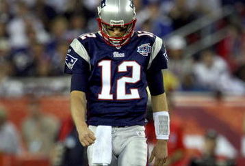 GLENDALE, AZ - FEBRUARY 03:  Quarterback Tom Brady #12 of the New England Patriots walks off the field in the second half of Super Bowl XLII against the New York Giants on February 3, 2008 at the University of Phoenix Stadium in Glendale, Arizona.  The Giants defeated the Patriots 17-14. (Photo by Donald Miralle/Getty Images)