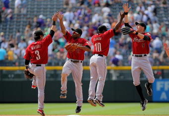 DENVER - MAY 14:  Kazuo Matsui #3, Michael Bourn #21, Miguel Tejada #10 and Hunter Pence #9 of the Houston Astros celebrate after defeating the Colorado Rockies during MLB action at Coors Field on May 14, 2009 in Denver, Colorado. The Astros defeated the Rockies 5-3.  (Photo by Doug Pensinger/Getty Images)