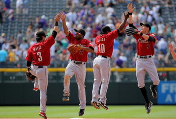 DENVER - MAY 14:  Kazuo Matsui #3, Michael Bourn #21, Miguel Tejada #10 and Hunter Pence #9 of the Houston Astros celebrate after defeating the Colorado Rockies during MLB action at Coors Field on May 14, 2009 in Denver, Colorado. The Astros defeated the Rockies 5-3.  (Photo by Doug Pensinger/Getty Images)