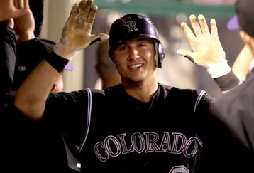 ANAHEIM, CA - JUNE 23:  Troy Tulowitzki #2 of the Colorado Rockies celebrates in the dugout after hitting a two-run home run in the sixth inning against the Los Angeles Angels of Anaheim at Angel Stadium June 23, 2009 in Anaheim, California.   (Photo by Stephen Dunn/Getty Images)