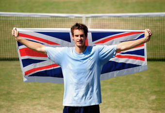 LONDON - JULY 01:  Andy Murray poses with the Union Jack flag during training on day eight of the Wimbledon Lawn Tennis Championships at the All England Lawn Tennis and Croquet Club on July 1, 2008 in London, England.   (Photo by Kieran Doherty/Pool/Getty Images)