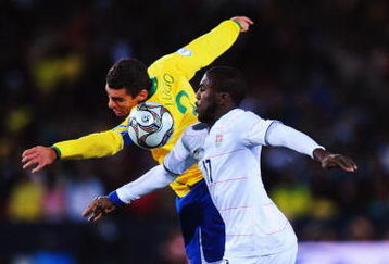 JOHANNESBURG, SOUTH AFRICA - JUNE 28:  Lucio of Brazil competes for the ball with Jozy Altidore of USA during the FIFA Confederations Cup Final between USA and Brazil at the Ellis Park Stadium on June 28, 2009 in Johannesburg, South Africa.  (Photo by Laurence Griffiths/Getty Images)